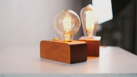 Loft cube wooden lamp on the table. Stock Footage 127779548