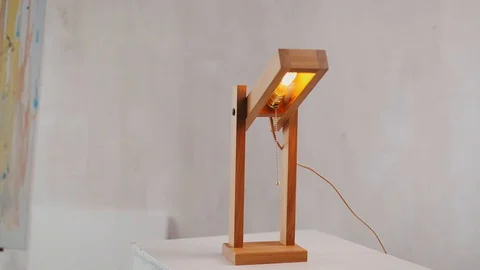 Loft cube wooden lamp on the table. Stock-Footage 127779569
