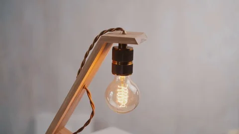 Loft cube wooden lamp on the table. Stock Footage 127779661
