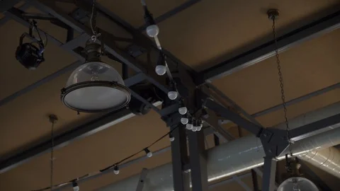 Loft interior. Ceiling lamps in the interior of the cafe Stock Footage 108998517