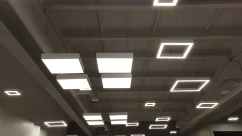 Loft office lighting. different geometric shapes of ceiling lights Stock Footage 154892424
