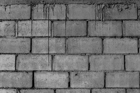 Loft-style block brick wall and cement pattern flow down. Stock Photos