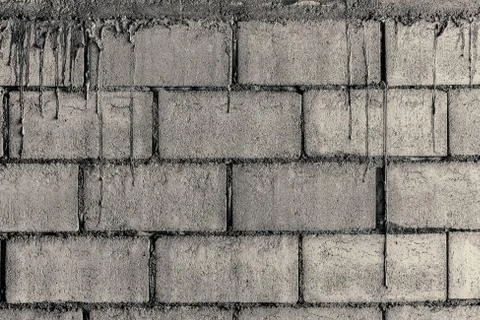 Loft-style block brick wall and cement pattern flow down. Stock Photos