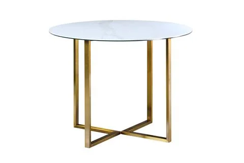 Loft-style kitchen table with round light stoneware countertop and golden Foto stock