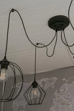 Loft style lamp hanging on the ceiling, interior decoration Stock Photos