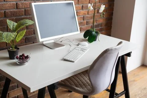 Loft workspace concept. white screen modern desktop computer and books, minimal Stock Photos
