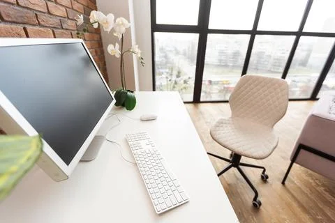 Loft workspace concept. white screen modern desktop computer and books, minimal Stock Photos
