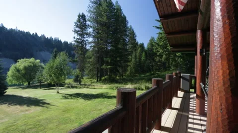 Log balcony pan to beautiful river nature view  Video stock 45880315
