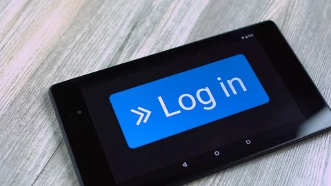 Log in Button pressed on tablet Stock Footage 69810119