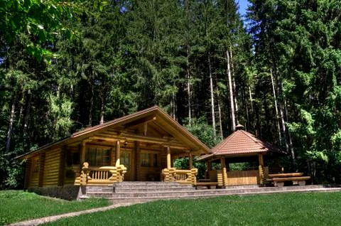Log cabin with fireplace Stock Photos