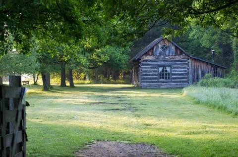 Log cabin on trail Stock Photos