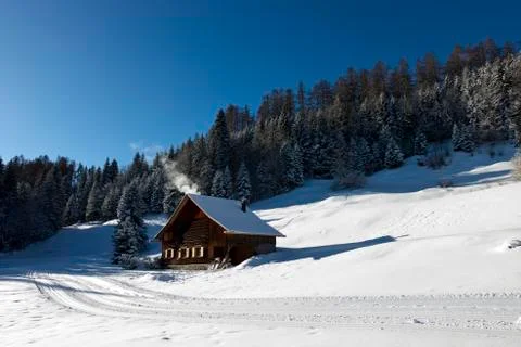 Log cabin in winter Photos