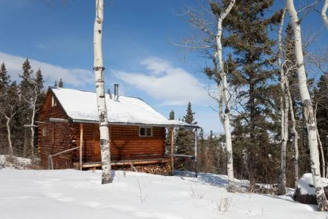 Log cabin in winter Stock Photos