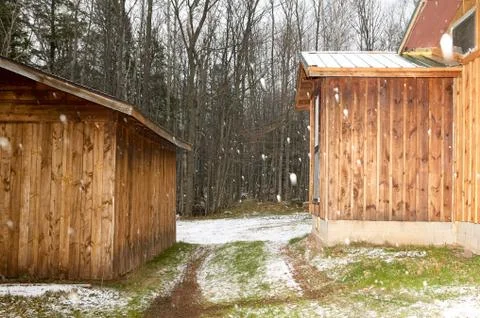 Log cabin in a winter snowfall Stock Photos