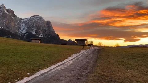 Log cabins under mountain at sunset Stock Footage 233832441