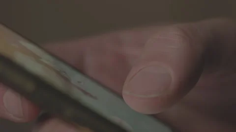 Log cinematic side view of a finger doom scrolling Stock Footage 234662896