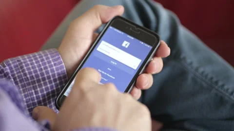 Log in to facebook on smartphone Stock Footage 56050668