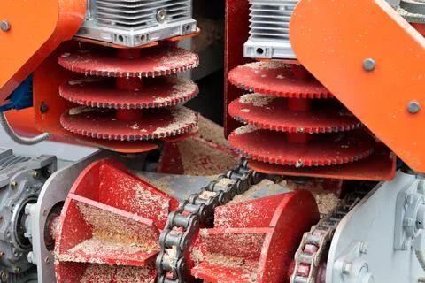 Log feed conveyor for saw machine at sawmill Stock Photos
