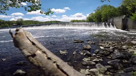 Log in Foreground of Wide Shot Lehigh River Chain Dam Stock Footage 76086700