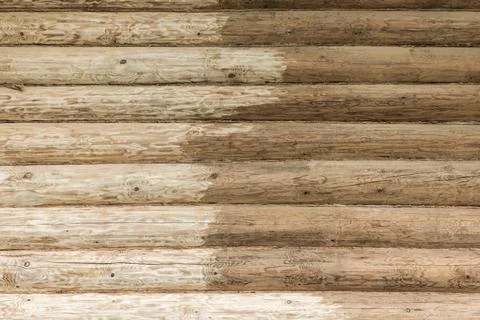 Log sanding is in progress, weathered horizontal timber logs 写真素材