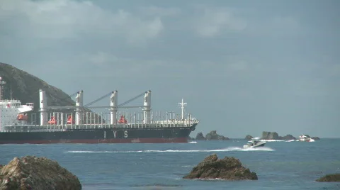 Log ship plus boats leave harbor. Stock Footage 540858