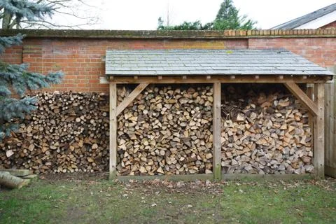 Log store with firewood Stock Photos
