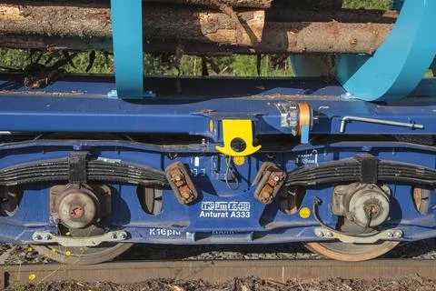 Log train flat car undercarriage and suspension, Finland Stock Photos