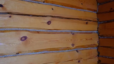 Log wall with jute insulation. Old village house, Old logs and tow. Close-u.. Stock Footage 337960566