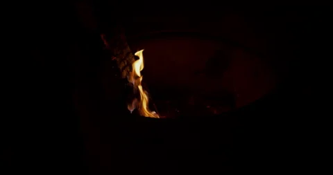Log of wood burning in a large can Stock Footage 167058305