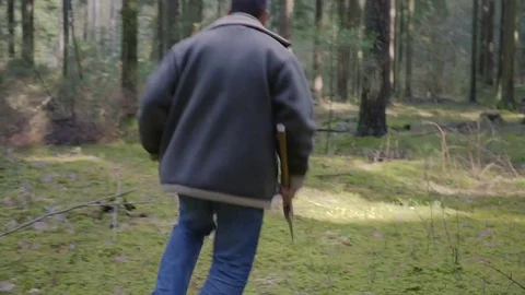 Logger runs away with an ax 스톡 동영상 73788760