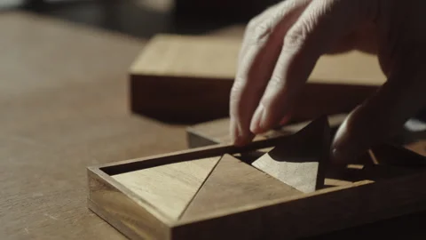 Logical Thinking Guides Successful Completion of Wooden Puzzle Challenge Stock Footage 337762744