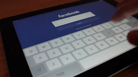 Loging into facebook on tablet Video stock 33729566