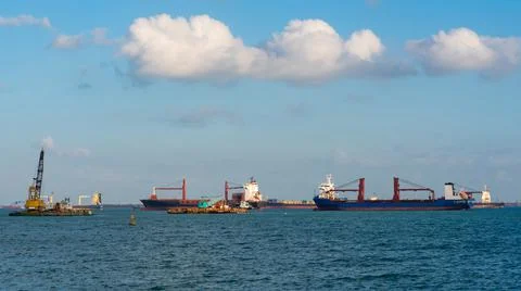 Logistic container ship at shipping yard main transportation Stock Photos