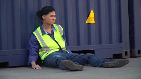 Logistic worker man  unemployed stress sitting on container background in w.. Stock Footage 241714128