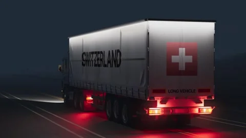 Logistics and Transportation Driving Truck Lorry at Night with Flag and Text Stock Footage 293942953