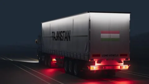 Logistics and Transportation Driving Truck Lorry at Night with Flag and Text Stock Footage 293943053