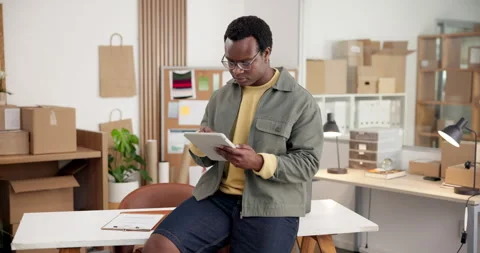 Logistics, boxes and black man with tablet for small business management Stock Footage 345701974