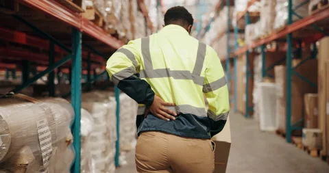 Logistics, boxes and man in warehouse with back pain, injury or accident on site Stock Footage 281099570