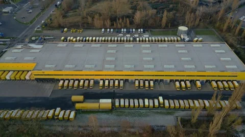 Logistics center building, delivery vans providing distribution. Best aerial Stock Footage 322186993