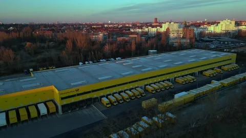 Logistics center, delivery vans distribution. Magic aerial view flight drone Stock Footage 321820031