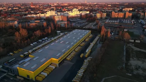 Logistics center, delivery vans distribution. Dramatic aerial view flight drone Stock Footage 321820057