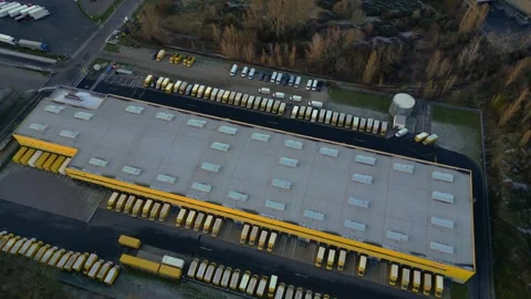 Logistics center, delivery vans distribution. Majestic aerial view flight drone Stock Footage 321821615