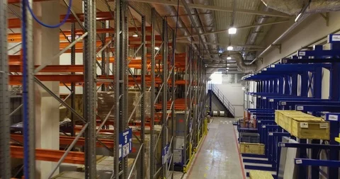 Logistics center interior full of racks with with large number packs Stock Footage 126953523