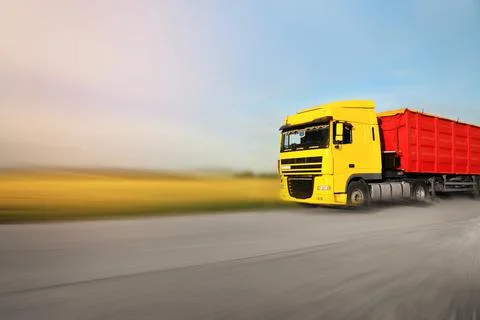 Logistics concept. Truck on country road, motion blur effect Stock Photos