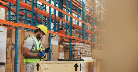 Logistics, crate or man with drill in warehouse for box assembly, safety co.. Stock Photos