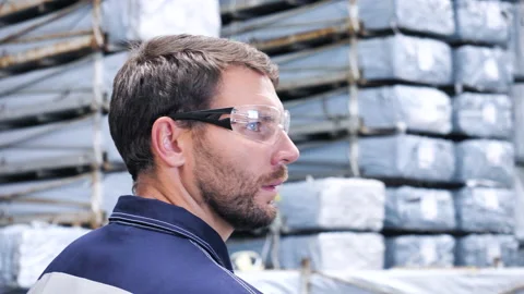 Logistics Engineer In Warehouse Walking Past Shelves Full Industrial Goods. Stock-Footage 146542454