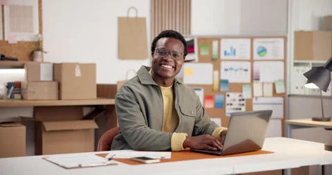 Logistics, face and black man in agency with laptop, confidence and pride as Stock Footage 345705140