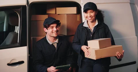 Logistics, face and team with boxes at delivery van for distribution, fist bump Stock Footage 341574283