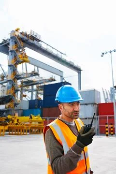 Logistics, feedback and man at dock with radio, shipment track and site ope.. Stock Photos