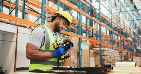 Logistics, man and drill tool in warehouse for cargo assembly, kitting and .. Fotos Stock